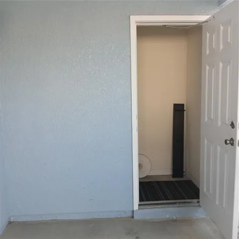 a view of backyard with a tub and chair