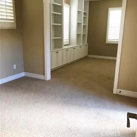 an empty room with windows
