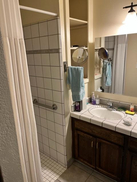 1152 Menlo Avenue Clovis, CA 93612 - Photo 6 of 9 a bathroom with a sink and a mirror