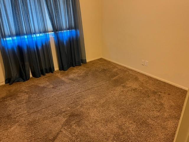 1152 Menlo Avenue Clovis, CA 93612 - Photo 8 of 9 a view of a backyard with wooden fence