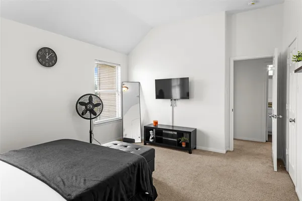 a view of a livingroom and a kitchen with a sink