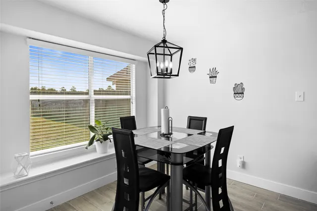 a view of a dining room with furniture window and outside view