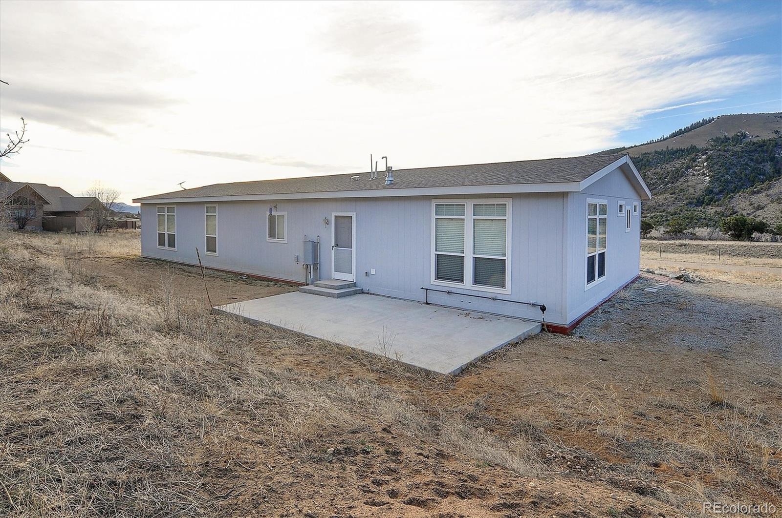 16554 Rocky Mountain Road Salida, CO 81201 - Photo 33 of 33 a view of a house with a backyard