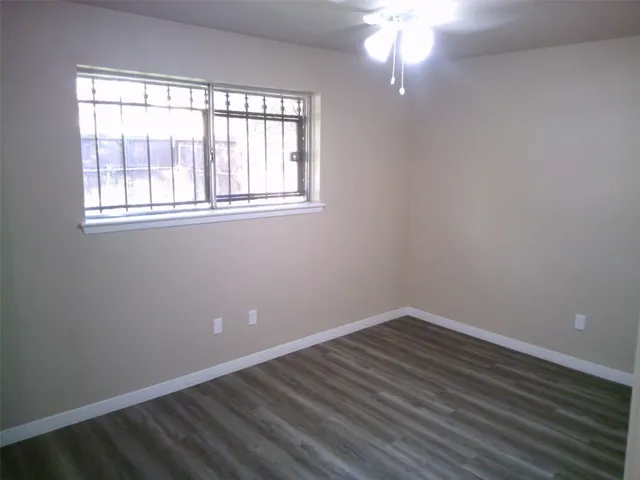 a white toilet and a shower in a bathroom