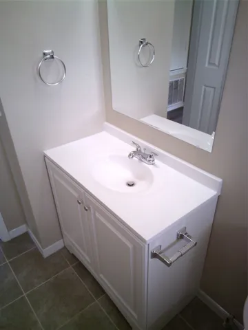 a bathroom with a sink and toilet