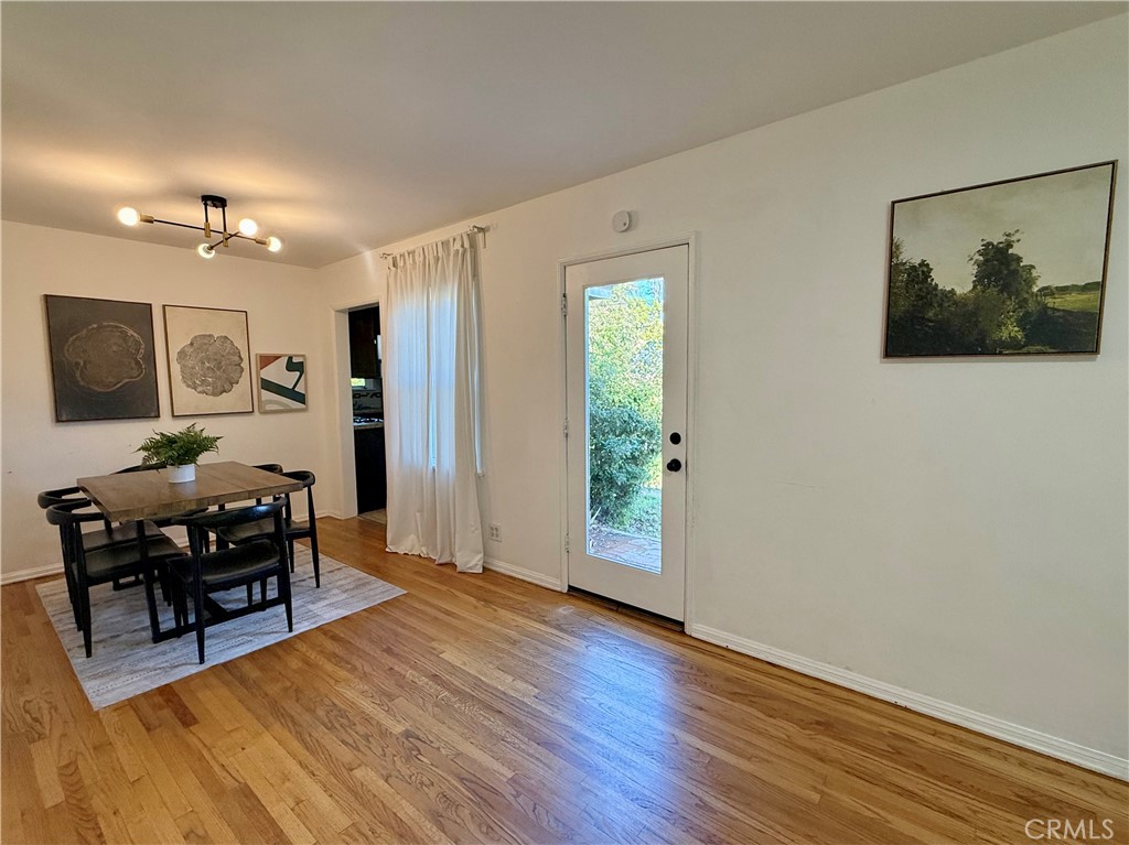 6948 Balcom Avenue Reseda, CA 91335 - Photo 11 of 30 a view of a livingroom with furniture and wooden floor
