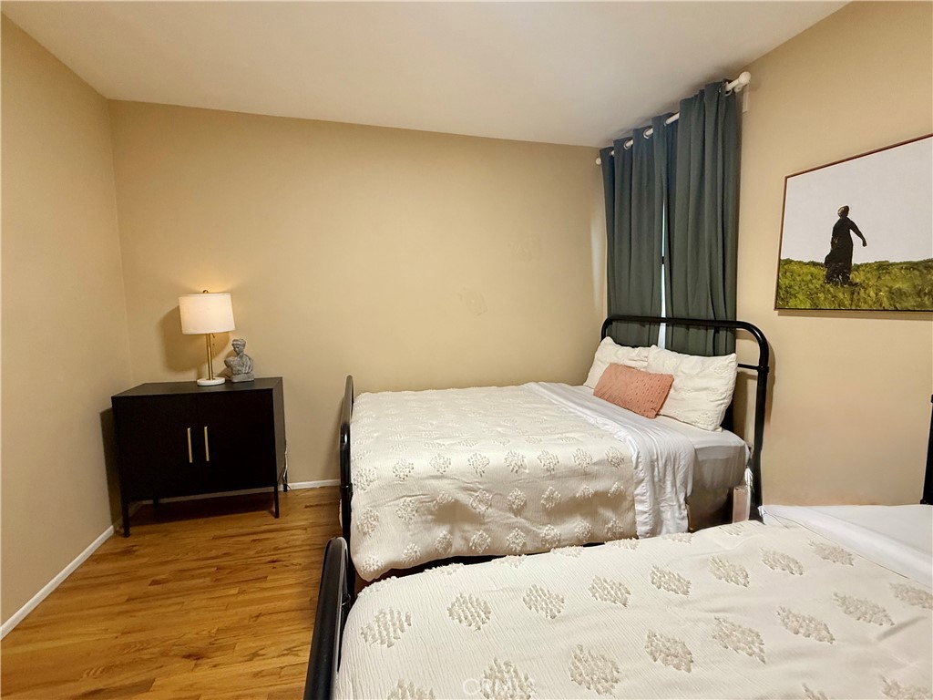 6948 Balcom Avenue Reseda, CA 91335 - Photo 21 of 30 a bedroom with a bed and a window