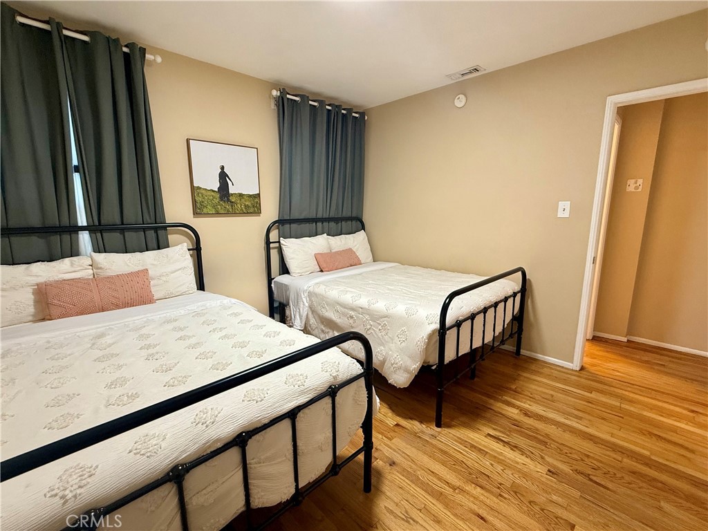 6948 Balcom Avenue Reseda, CA 91335 - Photo 22 of 30 a bedroom with two beds and a dresser