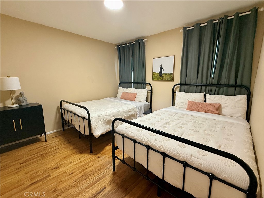 6948 Balcom Avenue Reseda, CA 91335 - Photo 24 of 30 a bedroom with two beds and a dresser