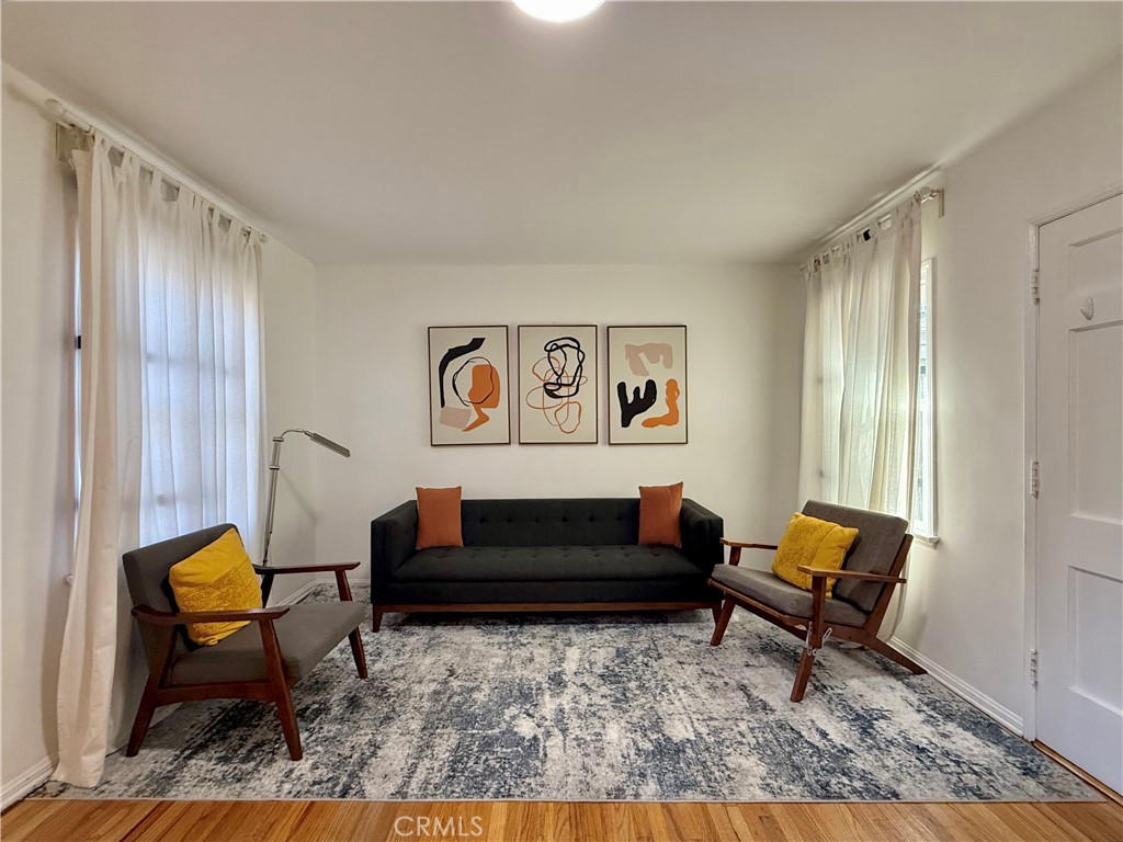 6948 Balcom Avenue Reseda, CA 91335 - Photo 4 of 30 a living room with furniture and a rug