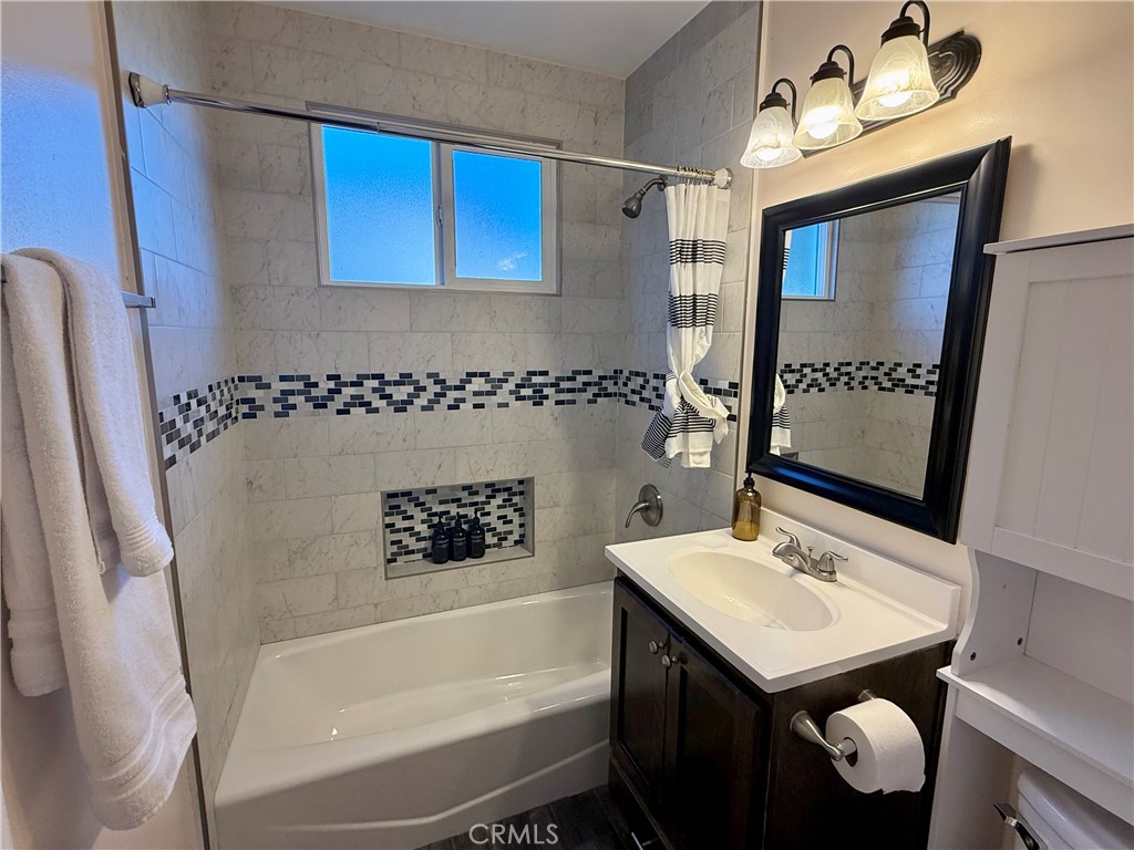 6948 Balcom Avenue Reseda, CA 91335 - Photo 5 of 30 a bathroom with a sink a toilet and shower