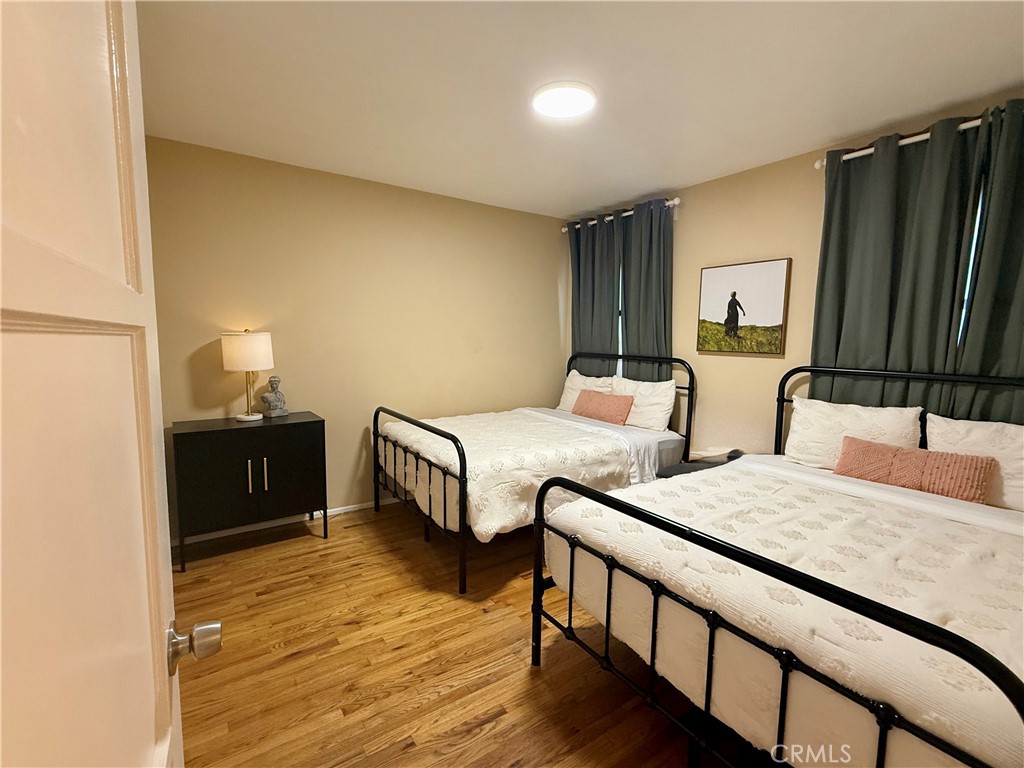 6948 Balcom Avenue Reseda, CA 91335 - Photo 6 of 30 a bedroom with two beds and a dresser
