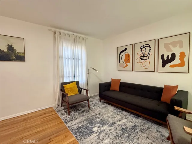 a living room with furniture and a rug