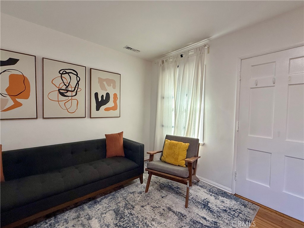 6948 Balcom Avenue Reseda, CA 91335 - Photo 10 of 30 a living room with furniture and a window