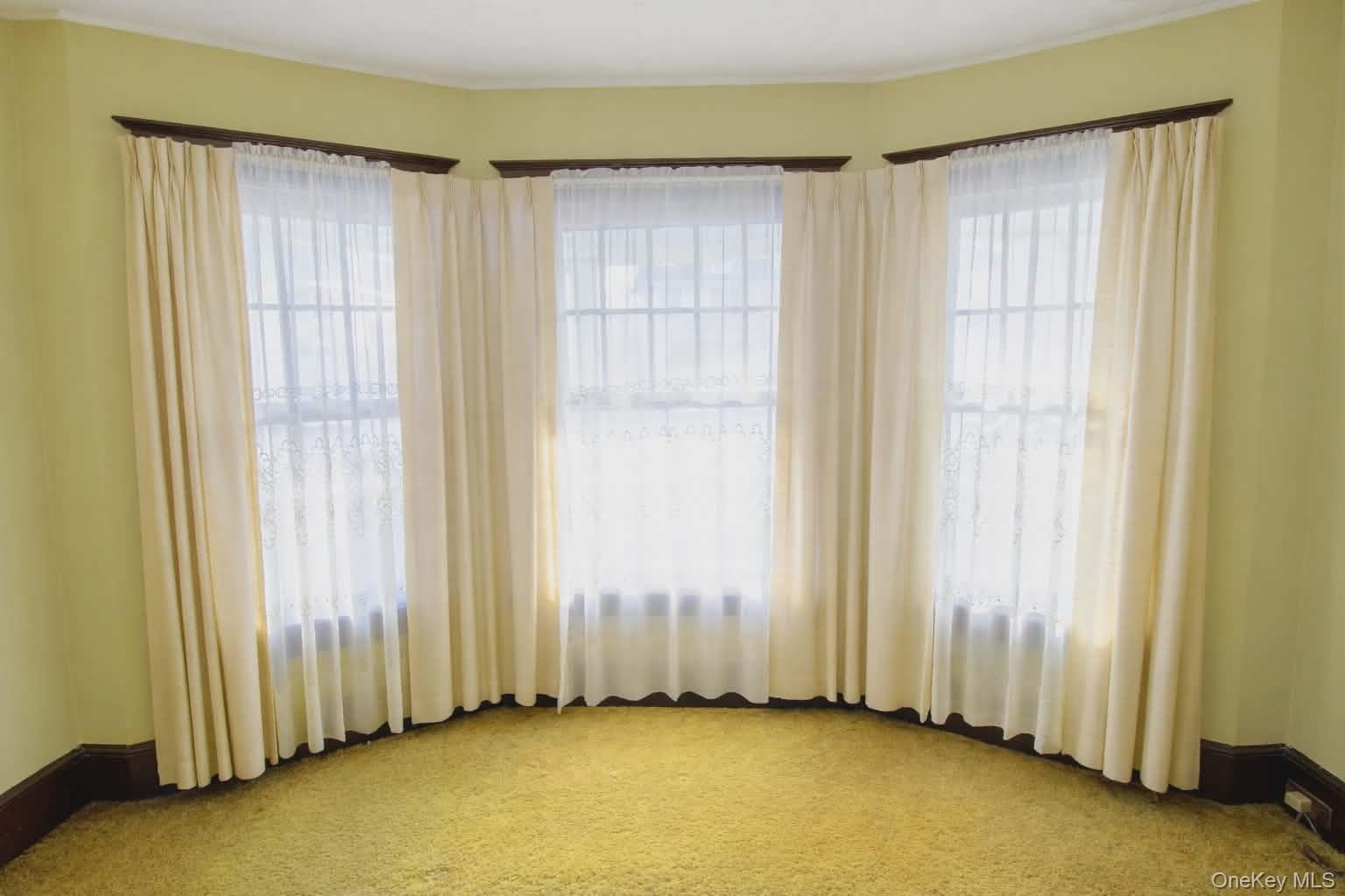 409 Baker Street Poughkeepsie, NY 12603 - Photo 11 of 23 a view of a room with a window and a door