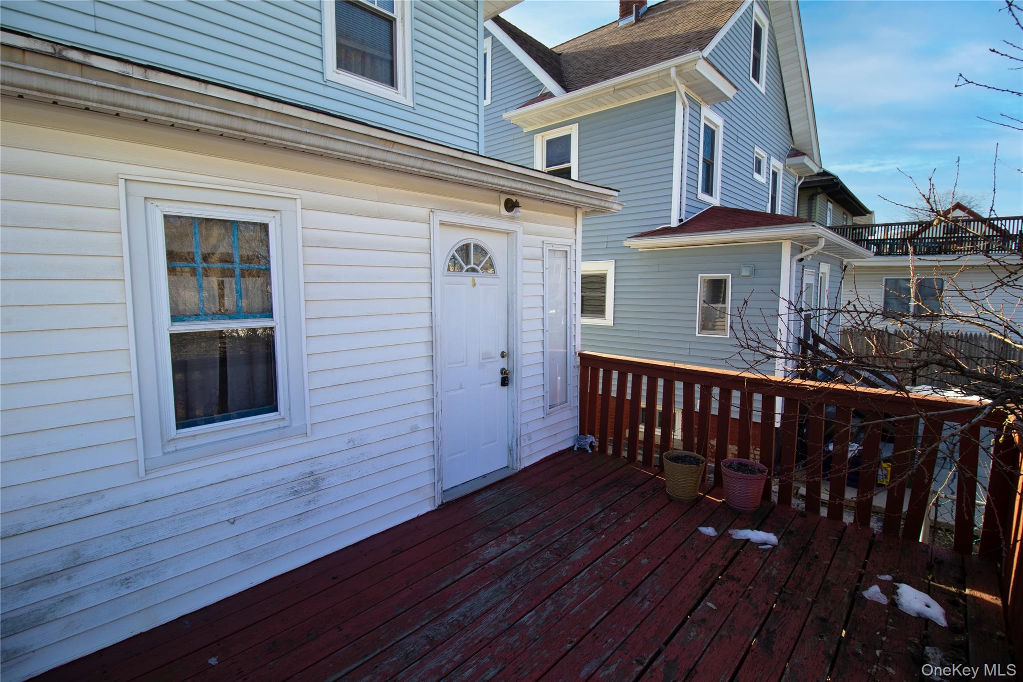 409 Baker Street Poughkeepsie, NY 12603 - Photo 5 of 23 a view of a house with wooden deck