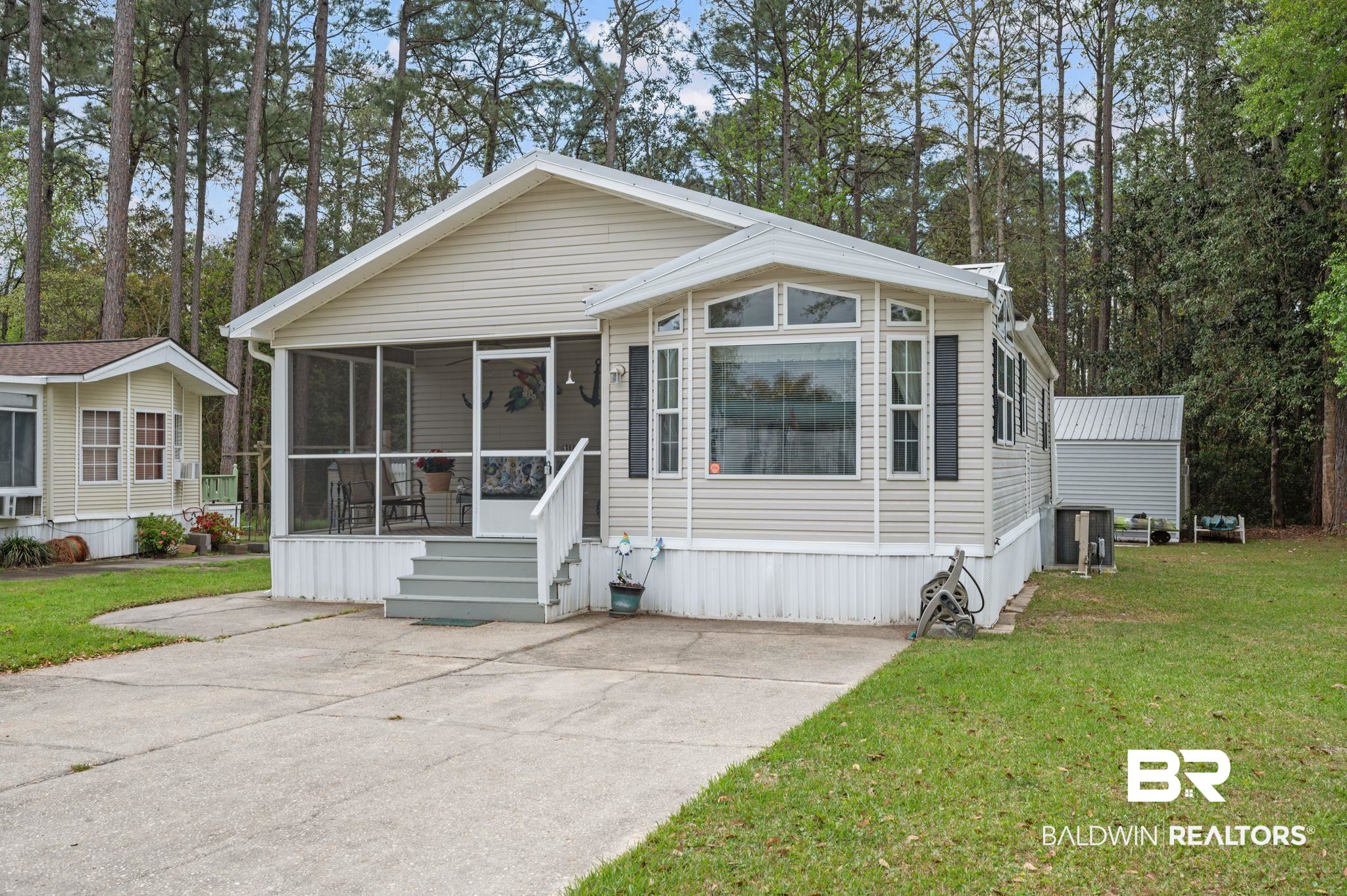 24711 County Road 20, Unit A11 Elberta, AL 36530 - Photo 3 of 35 Manufactured / mobile home featuring a sunroom and a front lawn