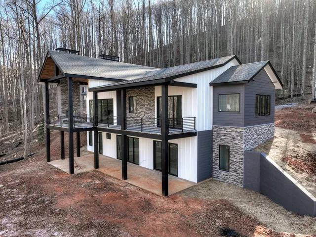 a front view of a house with parking area