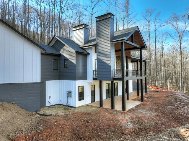 a view of a house with wooden fence