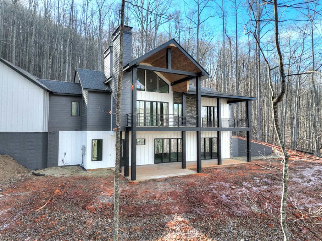 2 Grand Oaks S/d Morganton, GA 30560 - Photo 4 of 30 a front view of a house with a yard and garage