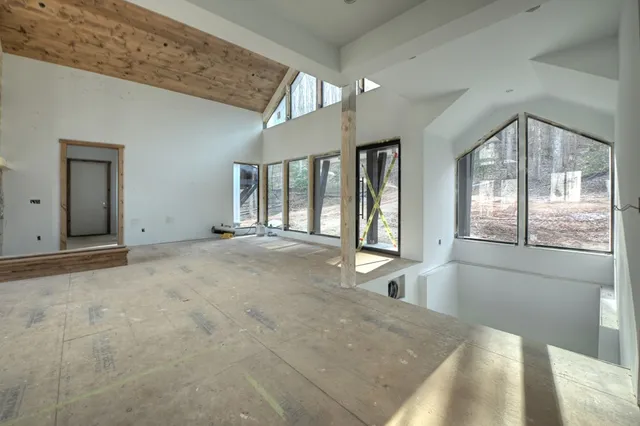 a view of an empty room with glass door