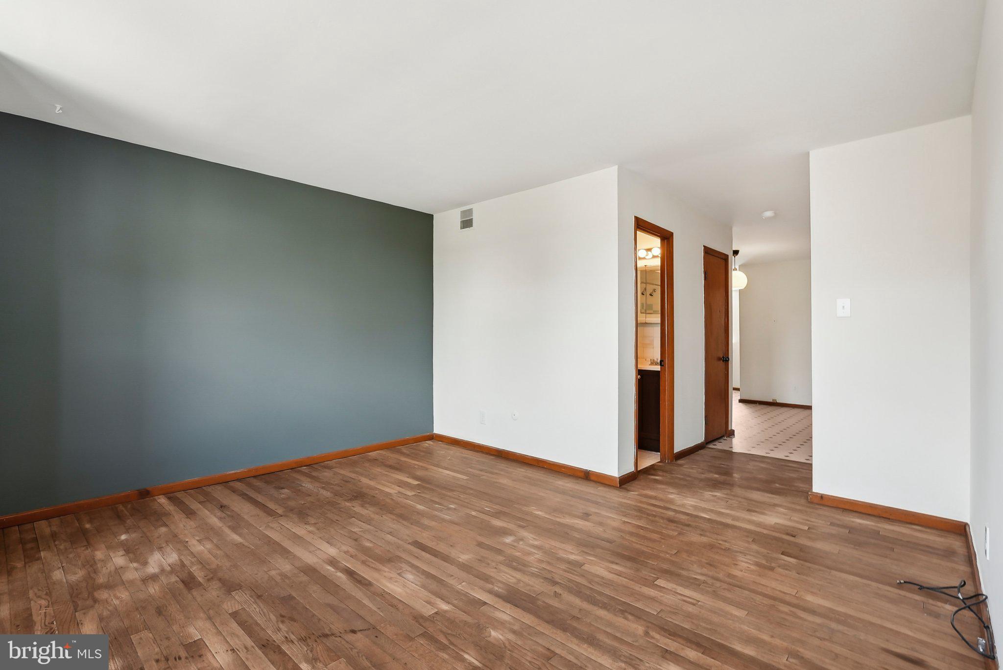 824 Fitzwater Street, Unit 2F Philadelphia, PA 19147 - Photo 3 of 13 a view of an empty room with wooden floor