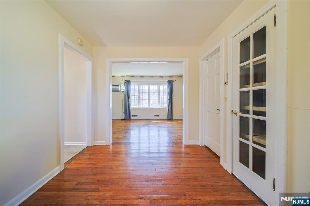 50 Knolls Road Bloomingdale, NJ 07403 - Photo 11 of 36 an empty room with wooden floor and windows