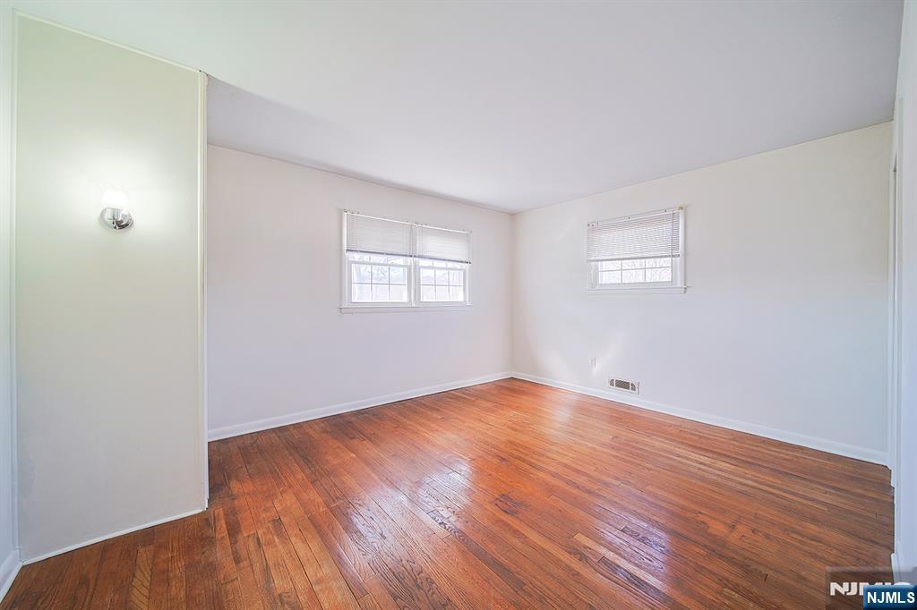 50 Knolls Road Bloomingdale, NJ 07403 - Photo 21 of 36 a view of an empty room with wooden floor and a window