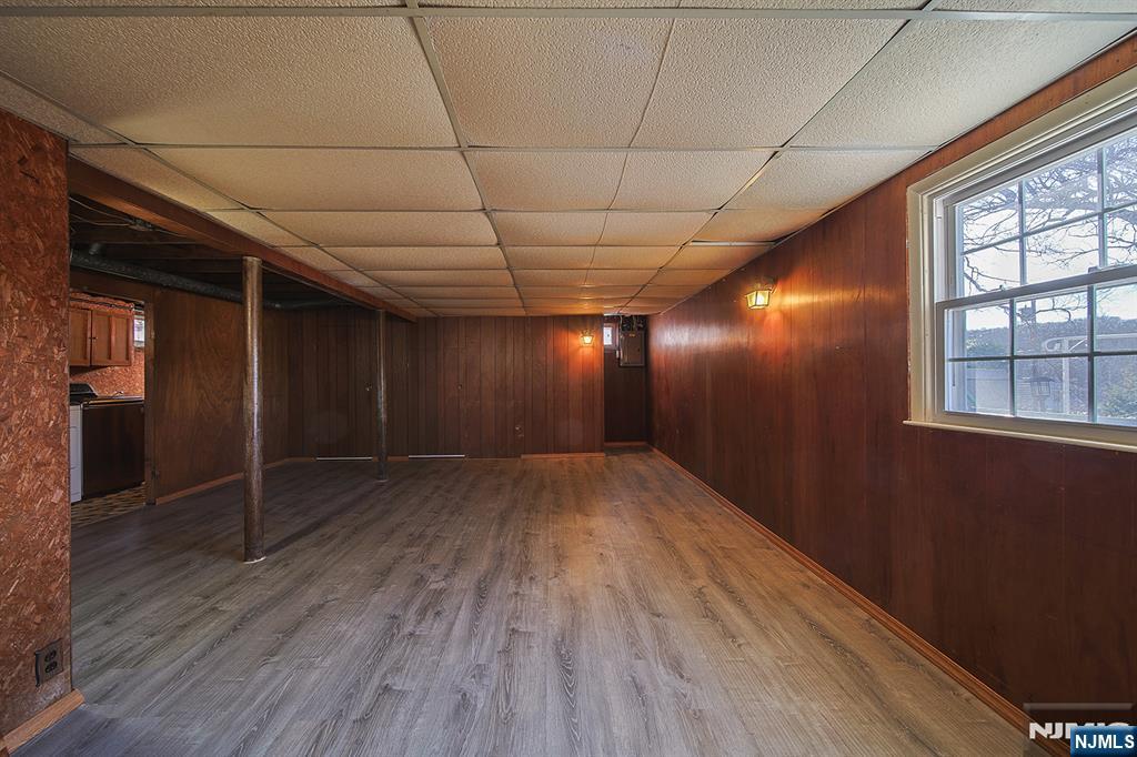 50 Knolls Road Bloomingdale, NJ 07403 - Photo 24 of 36 an empty room with wooden floor and windows