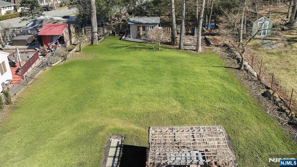 50 Knolls Road Bloomingdale, NJ 07403 - Photo 34 of 36 a backyard of a house with table and chairs