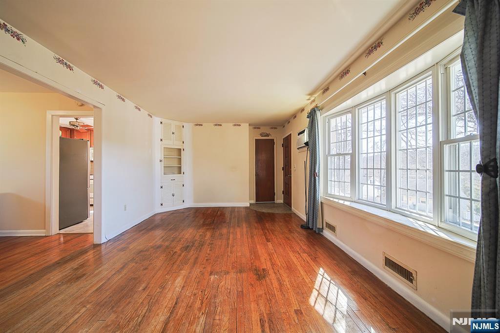 50 Knolls Road Bloomingdale, NJ 07403 - Photo 5 of 36 a view of an empty room with wooden floor and a window