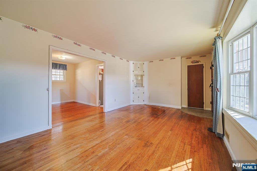 50 Knolls Road Bloomingdale, NJ 07403 - Photo 6 of 36 a view of an empty room with wooden floor and a window