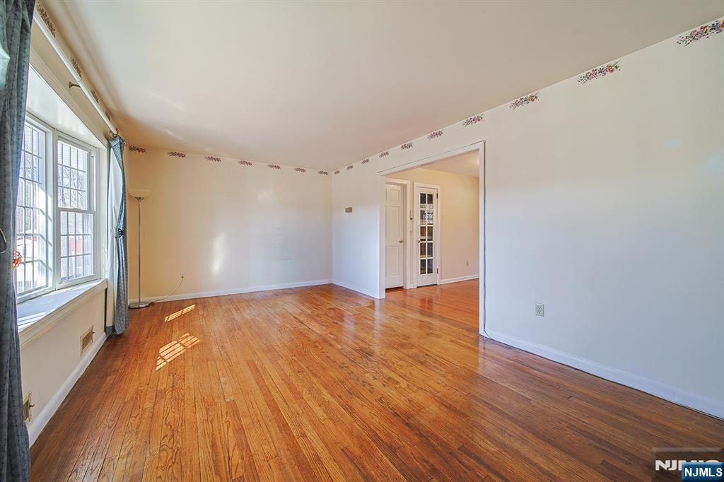 50 Knolls Road Bloomingdale, NJ 07403 - Photo 7 of 36 a view of an empty room with wooden floor and a window