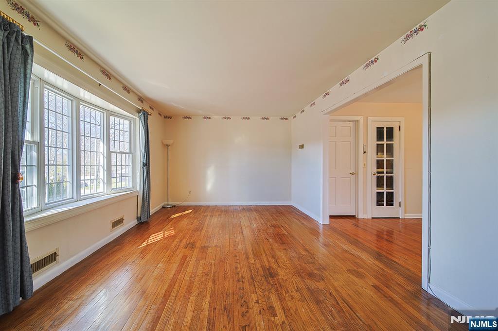 50 Knolls Road Bloomingdale, NJ 07403 - Photo 8 of 36 a view of an empty room with wooden floor and a window