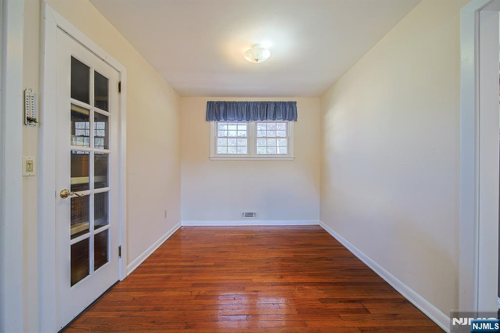 50 Knolls Road Bloomingdale, NJ 07403 - Photo 9 of 36 wooden floor in an empty room with a window