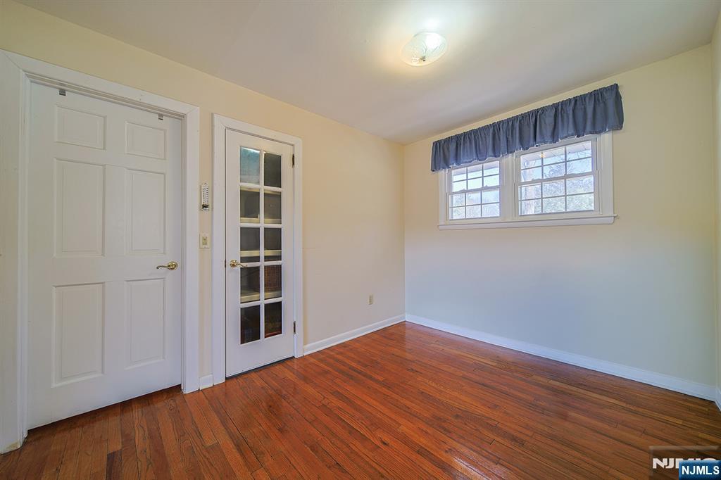 50 Knolls Road Bloomingdale, NJ 07403 - Photo 10 of 36 wooden floor in an empty room with a window