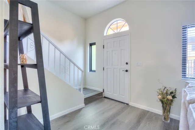 a view of entryway with wooden floor