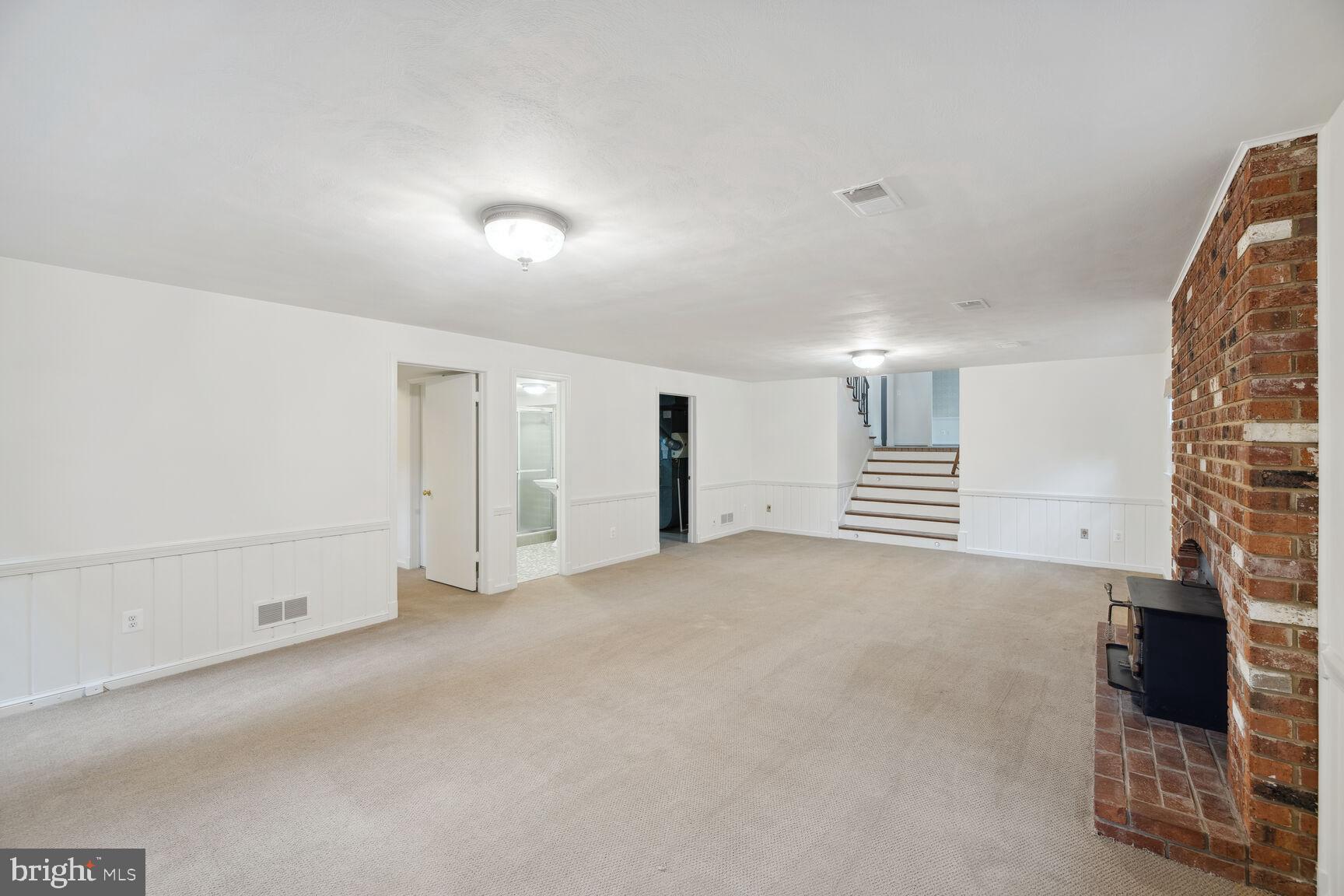 6313 Stoneham Lane McLean, VA 22101 - Photo 27 of 37 Very large basement with wood burning fireplace