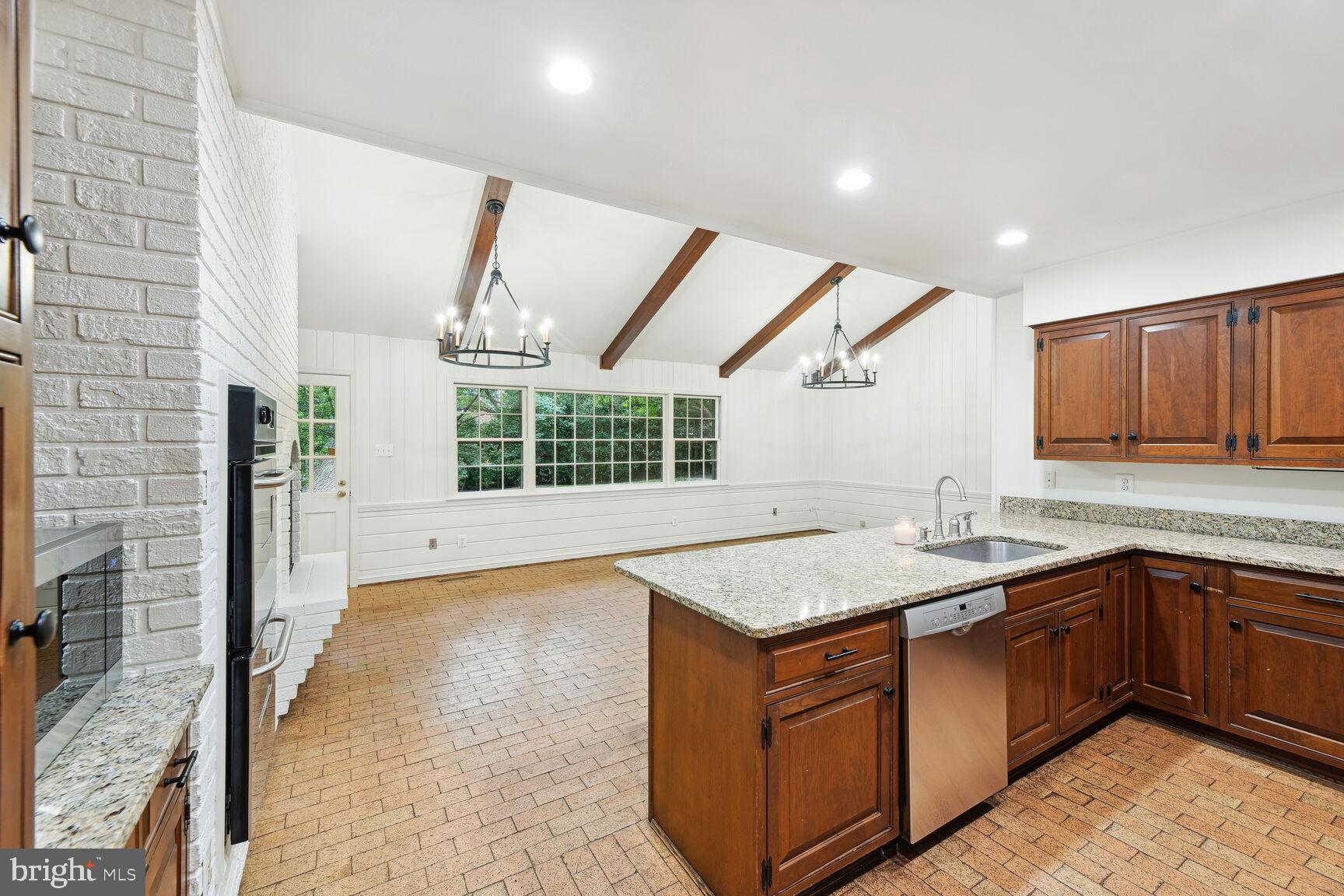 6313 Stoneham Lane McLean, VA 22101 - Photo 9 of 37 Vaulted ceilings with beams in large kitchen