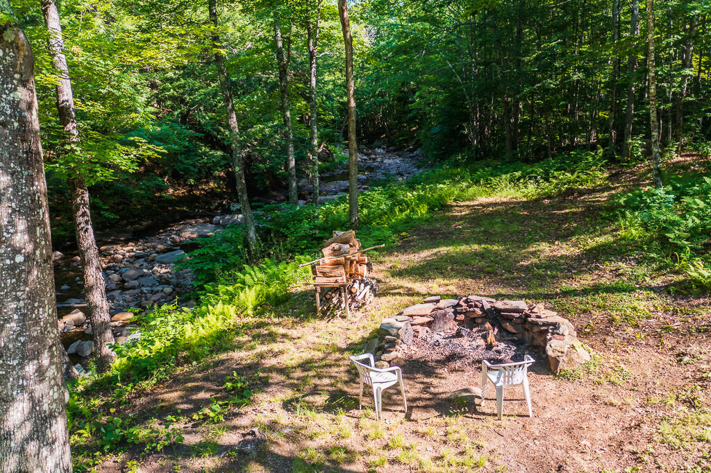 269 Jenkins Road Temple, ME 04984 - Photo 48 of 51 Fire pit by stream
