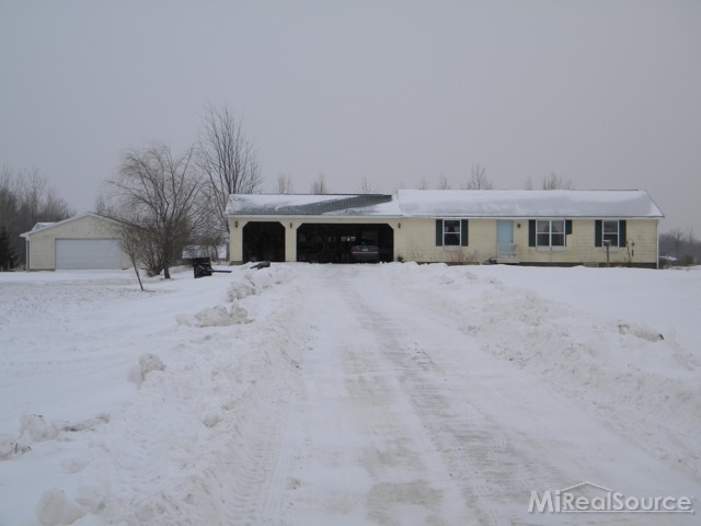 13219 Tibbets Road Memphis, MI 48041 - Photo 1 of 21 This is a view of the front of the home.