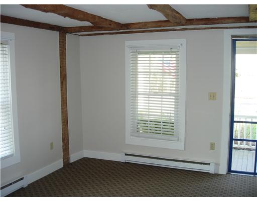 4299 Old Post Road Charlestown, RI 02813 - Photo 2 of 12 Living Room. Living room, front door to left, leads to front porch. All new carpet in first floor apt.