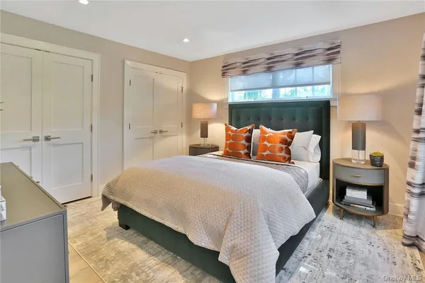 a bedroom with a bed and a fireplace