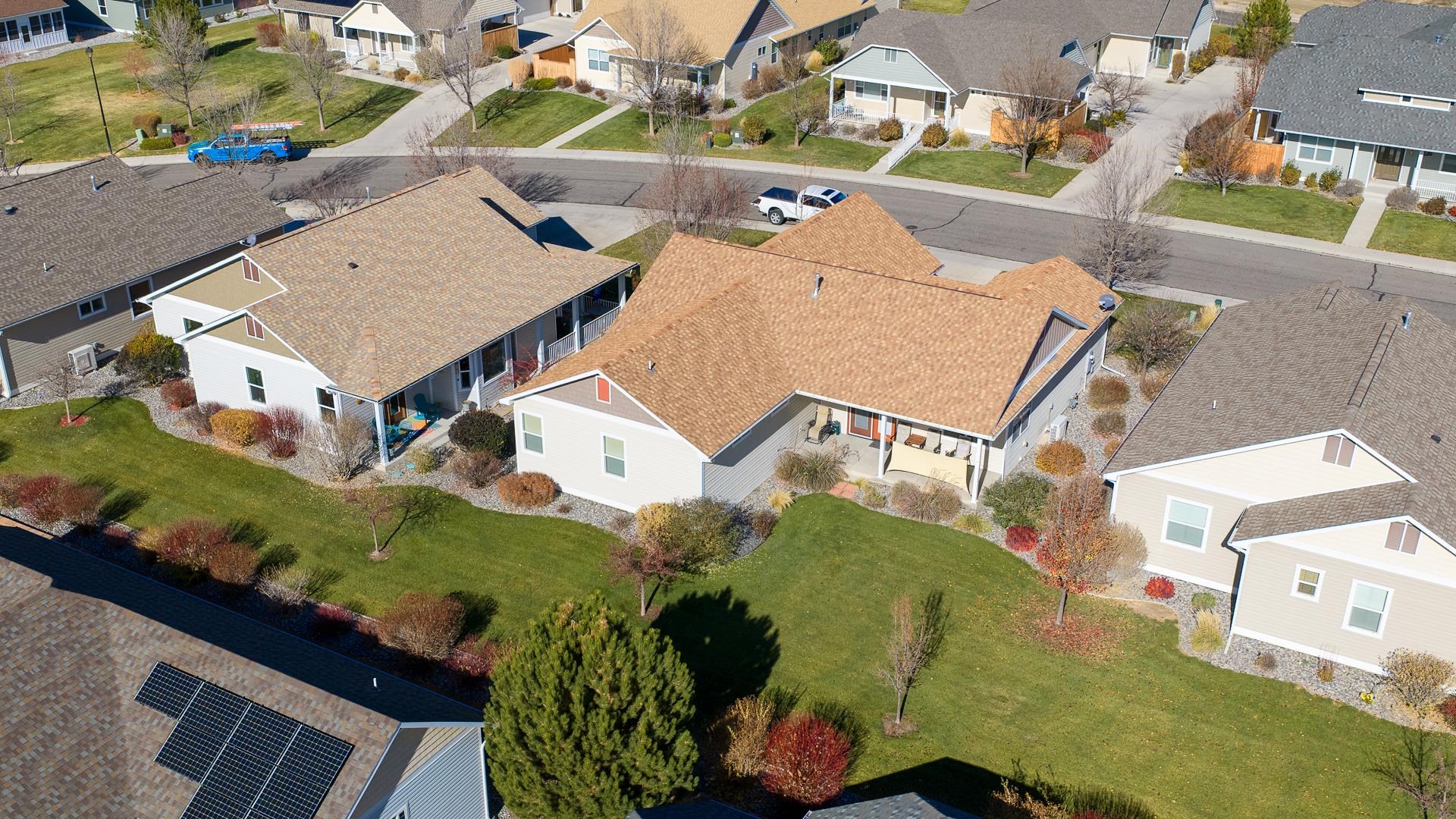 1206 Periwinkle Lane Fruita, CO 81521 - Photo 20 of 20 an aerial view of a house with a yard and potted plants