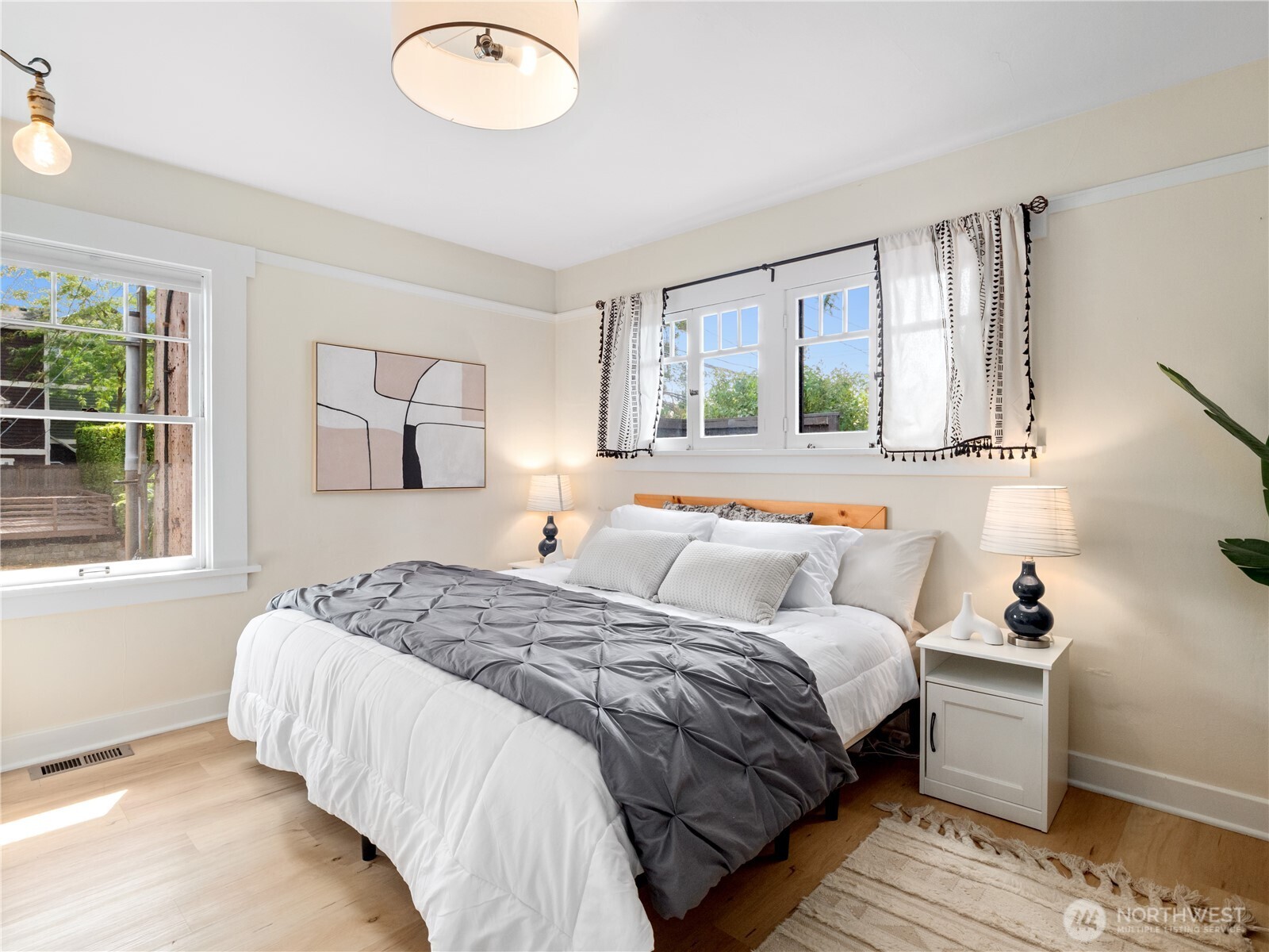 9701 Roosevelt Way Northeast Seattle, WA 98115 - Photo 12 of 33 a bedroom with a bed and a window