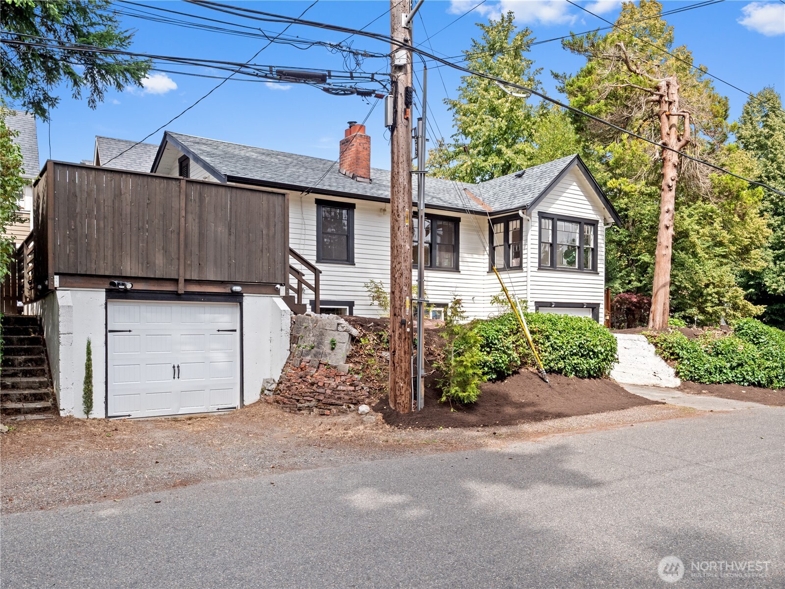 9701 Roosevelt Way Northeast Seattle, WA 98115 - Photo 23 of 33 front view of a house with a street