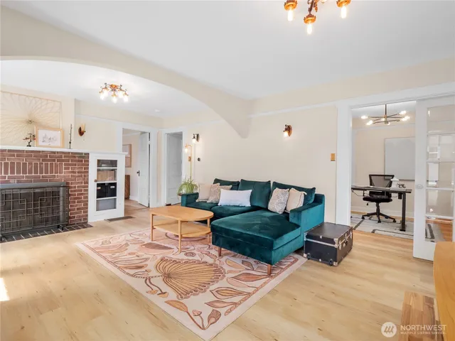 a living room with furniture and a fireplace
