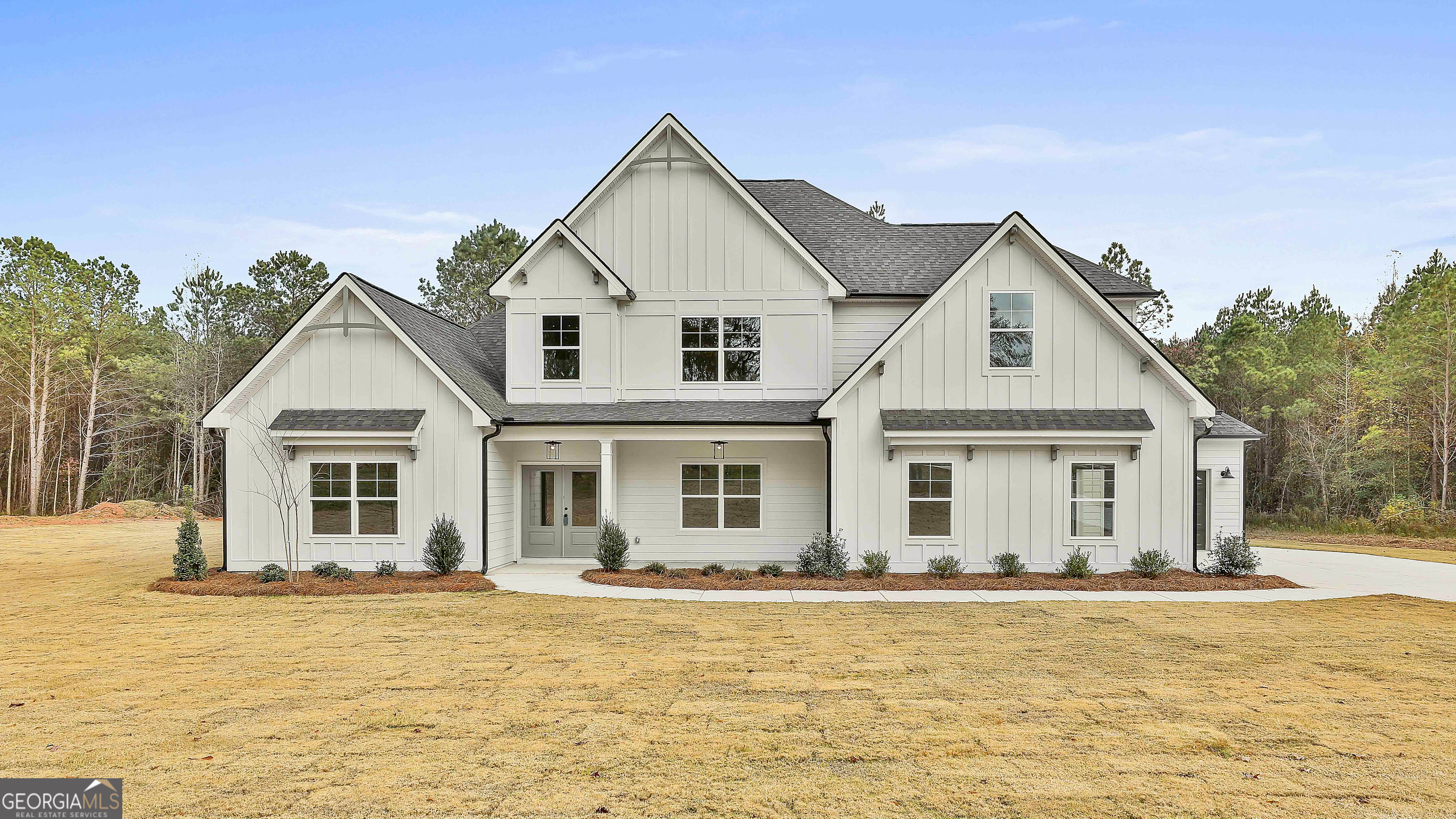 a front view of a house with a yard