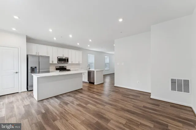 a view of kitchen with wooden floor