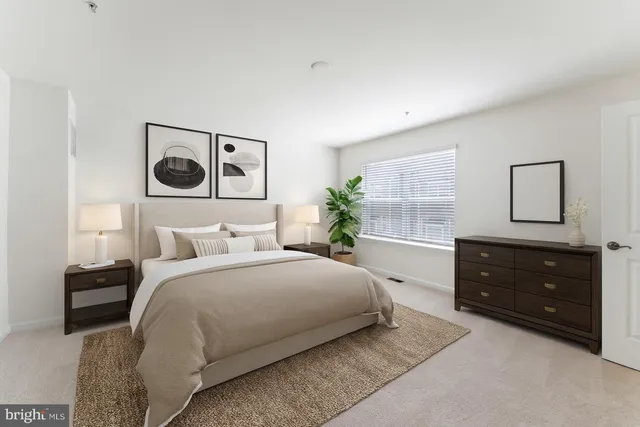 a bedroom with a bed and a dresser